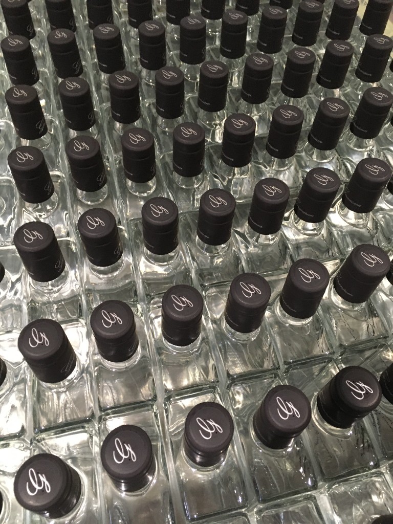 Bottles of Geranium Gin, capped and ready.